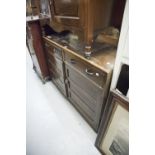 AN OAK SIDEBOARD, WITH TWO DRAWERS OVER CUPBOARD WITH TWO DOORS AND STAINED WOOD OAK TALL CABINET (