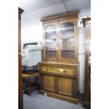 A VICTORIAN MAHOGANY AND WALNUT SECRETAIRE, THE STEPPED CORNICE OVER DOUBLE GLAZED DOORS TO BASE,