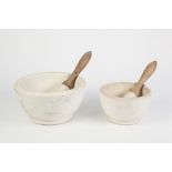 TWO LARGE PESTLES AND MORTARS, (4)