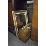 A SEWING MACHINE, IN DOME TOP CASE AND A BEVEL EDGE WALL MIRROR, IN GILT FRAME (2)