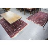TWO MODERN MIDDLE EASTERN STYLE RUGS ON WINE RED GROUND