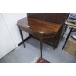 AN INLAID MAHOGANY FOLD OVER CARD TABLE, WITH CANTED CORNERS ON SQUARE TAPERING SUPPORTS, WITH