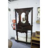 A VICTORIAN MAHOGANY HALL STAND, THE CENTRAL OVAL MIRROR OVAL SHELF, CARVED DECORATION THROUGH-