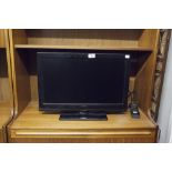 A TECHNIKA SMALL FLAT SCREEN TV WITH REMOTE CONTROL