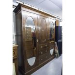 LATE NINETEENTH CENTURY INLAID OAK BEACONSFIELD TYPE WARDROBE WITH TWO OVAL MIRROR PANEL DOORS (A.