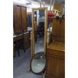 A MODERN PINE CHEVAL DRESSING MIRROR AND A WOODEN FRAMED OVAL WALL MIRROR