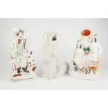 TWO NINETEENTH CENTURY STAFFORDSHIRE FLAT BACK GROUPS, one a spill vase modelled with two figures,