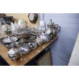 A SILVER PLATE TEA/COFFEE SERVICE OF FOUR PIECES AND ANOTHER OF THREE PIECES