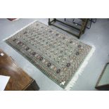 PAKISTAN BOKHARA RUG with two rows of guls on a green field, multiple border stripes, 5' x 3' 2" (