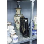 A LARGE ORIENTAL POTTERY VASE AND TWO BLACK AND GILT DECORATED GLASS VASES (3)