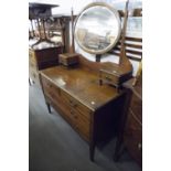 A MAHOGANY AND INLAID DRESSING TABLE WITH CENTRAL SWING MIRROR AND A MATCHING DOUBLE BEDSTEAD (2)