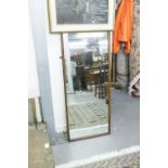 AN OBLONG WALL MOUNTED ROBING MIRROR WITH PLAIN MAHOGANY FRAME