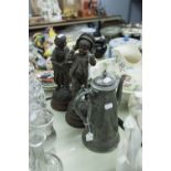 PAIR OF LATE 19th CENTURY FRENCH SPELTER FIGURES OF A BOY AND GIRL EXCHANGING HATS, ON TURNED WOODEN