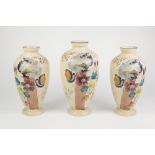 SET OF THREE VICTORIAN HAND PAINTED BEIGE COLOURED OPALINE GLASS VASES, each of footed ovoid form,