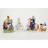 FOUR NINETEENTH CENTURY STAFFORDSHIRE POTTERY FIGURES, all painted in colours comprising: a female