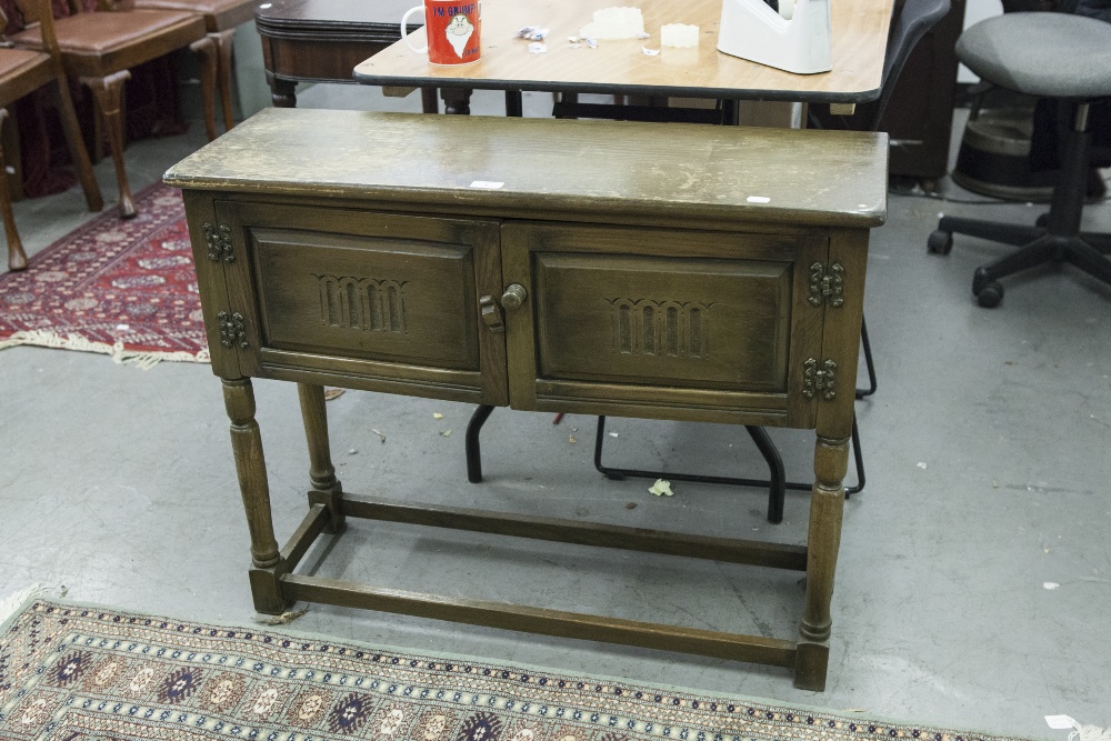 SMALL EIGHTEENTH CENTURY STYLE CARVED OAK TWO DOOR SMALL SIDE CUPBOARDS, WITH HINGES ON TURNED