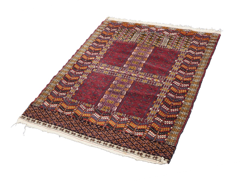 A FINELY KNOTTED AND INTRICATELY PATTERNED TURKOMAN PRAYER RUG, with four panel field with