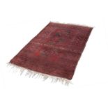 TURKOMAN HEAVY QUALITY TRIBAL RUG, with three large octagonal guls on a crimson field, the principal