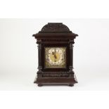 EARLY TWENTIETH CENTURY STYLE DARK MAHOGANY STAINED MANTLE CLOCK, the 6 ½" bras dial with silvered