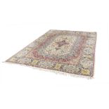 KASHMIR, FINELY KNOTTED CARPET, with a very intricate design, the floral centre medallion with