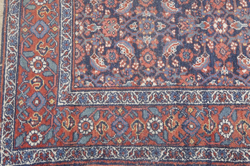 SHIRAZ PERSIAN RUG, with all over formal floral pattern on a midnight blue field, broad red and - Image 2 of 2