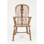 NINETEENTH CENTURY ELM AND OAK HIGH BACK WINDSOR ARMCHAIR, the hoop back above spindles, two part