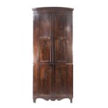 EARLY NINETEENTH CENTURY FLAME CUT MAHOGANY LARGE TWO SECTION FLOOR STANDING BOW FRONTED CORNER