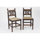 SET OF SIX NINETEENTH CENTURY CARVED OAK SINGLE DINING CHAIRS IN THE GOTHIC REVIVAL STYLE, each with