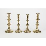 THREE PAIRS OF BRASS CANDLESTICKS WITH CIRCULAR BASES, including an antique pair with ejectors,