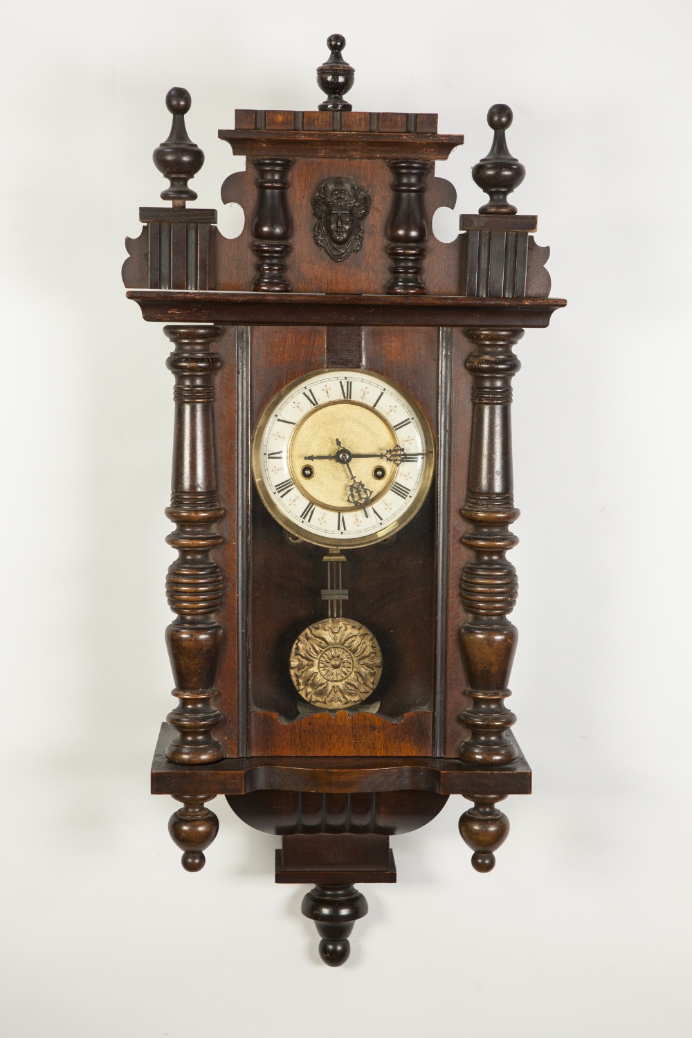EARLY TWENTIETH CENTURY VIENNA STYLE CARVED WALNUTWOOD AND FRUITWOOD WALL CLOCK, the 6" Roman dial