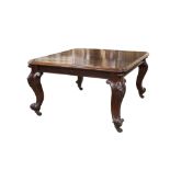 VICTORIAN MAHOGANY WIND-OUT EXTENDING DINING TABLE WITH AN EXTRA LEAF, the rounded oblong top