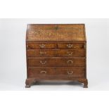 NINETEENTH CENTURY OAK AND MAHOGANY CROSSBANDED BUREAU, of typical form, the interior fitted with