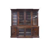 VICTORIAN AND LATER GRAIN PAINTED TO MAHOGANY BREAKFRONT LIBRARY BOOKCASE, the moulded cornice above