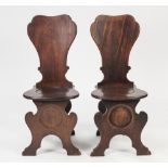 PAIR OF NINETEENTH CENTURY MAHOGANY HALL CHAIRS IN THE EARLY GEORGIAN STYLE, each with one piece fan