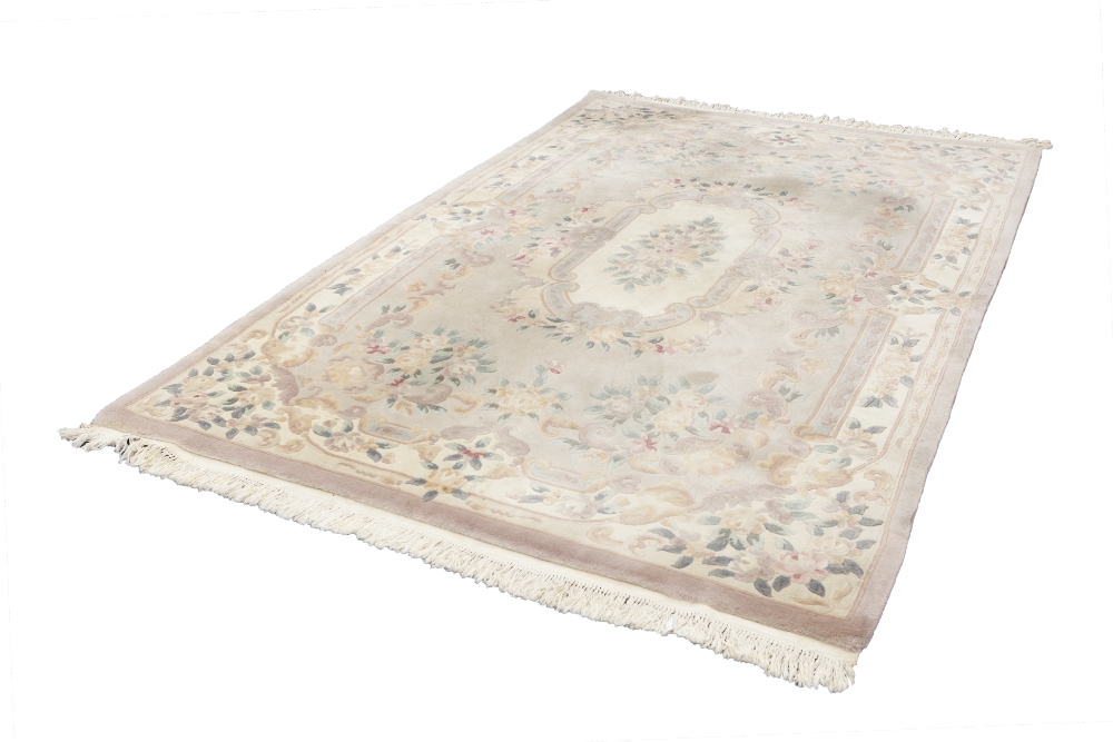 WASHED CHINESE CARPET OF AUBUSSON DESIGN, with large oval centre medallion on a mushroom and