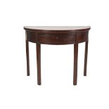 LATE EIGHTEENTH CENTURY MAHOGANY DEMI LUNE TEA TABLE, the fold over top above a deep frieze with