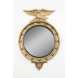 AISONEA, REGENCY STYLE GILT CONVEX WALL MIRROR, the circular plate in a moulded frame with