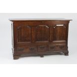 EIGHTEENTH CENTURY LARGE OAK DOWER CHEST, the moulded oblong top above a three panelled front with