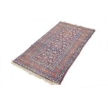 SHIRAZ PERSIAN RUG, with all over formal floral pattern on a midnight blue field, broad red and