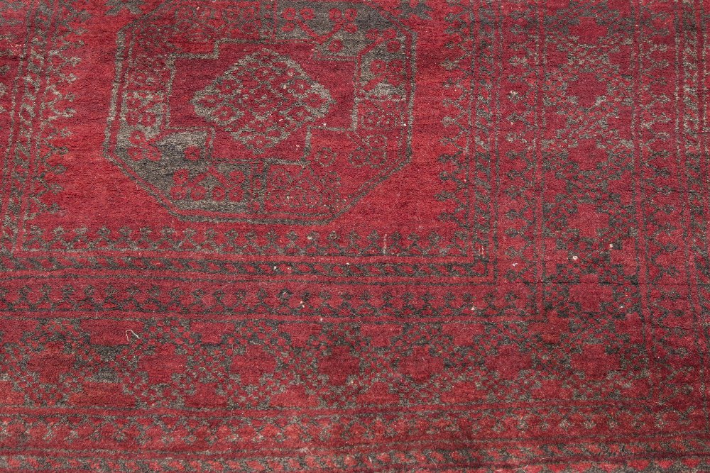 TURKOMAN HEAVY QUALITY TRIBAL RUG, with three large octagonal guls on a crimson field, the principal - Image 2 of 2