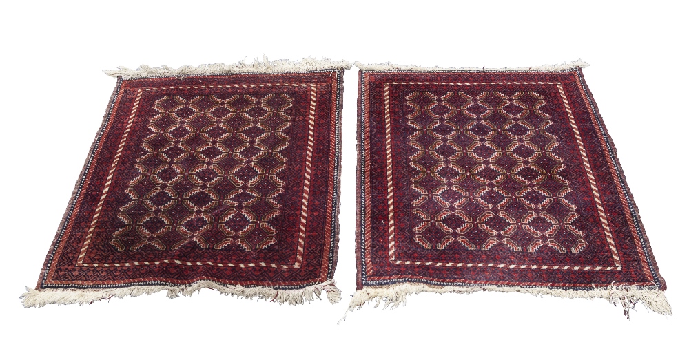 A PAIR OF TURKOMAN BOKHARA SMALL RUGS, with an all over pattern of interlocking diamond shaped