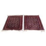 A PAIR OF TURKOMAN BOKHARA SMALL RUGS, with an all over pattern of interlocking diamond shaped