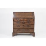 GEORGE III OAK BUREAU, of typical form, the interior fitted with pigeon holes and short drawers