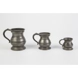 GRADUATED SET OF THREE PEWTER 'BELLY' MEASURES, 2", 3" and 4" (5.1m, 7.6m and 10.2cm) high, (3)