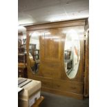 EDWARDIAN INLAID MAHOGANY BEACONSFIELD WARDROBE WITH DENTIL INLAID CORNICE, TWO OVAL MIRROR PANEL