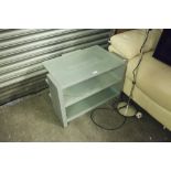 A GREEN FINISH THREE TIER GLASS SHELVED, OBLONG, LOW OCCASIONAL TABLE