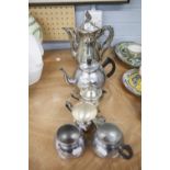 A SILVER PLATE TEA/COFFEE SERVICE OF FOUR PIECES AND ANOTHER OF THREE PIECES