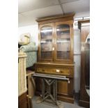 A VICTORIAN MAHOGANY AND WALNUT SECRETAIRE, THE STEPPED CORNICE OVER DOUBLE GLAZED DOORS TO BASE,