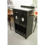 AN EDWARDIAN AESTHETIC MOVEMENT EBONISED MUSIC CABINET WITH INCISED GILT DECORATION, TWO DOORS