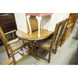 AN OAK DRAW-LEAF DINING TABLE AND SIX MATCHING CHAIRS (4 + 2)